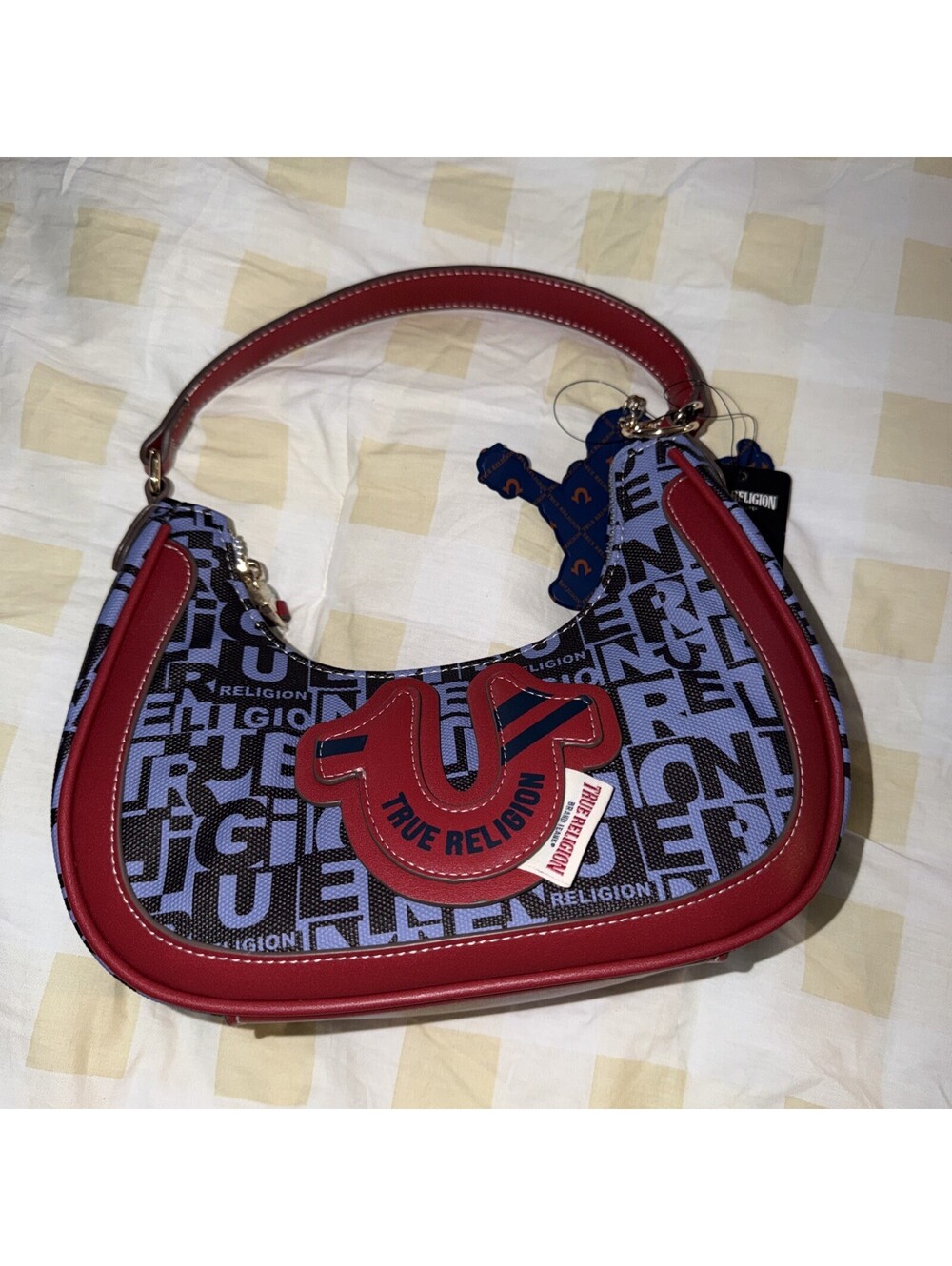 TRUE RELIGION GRAPHIC HORSESHOE HOBO BAG WITH BUDDHA CHARM AND LOGO PRINT